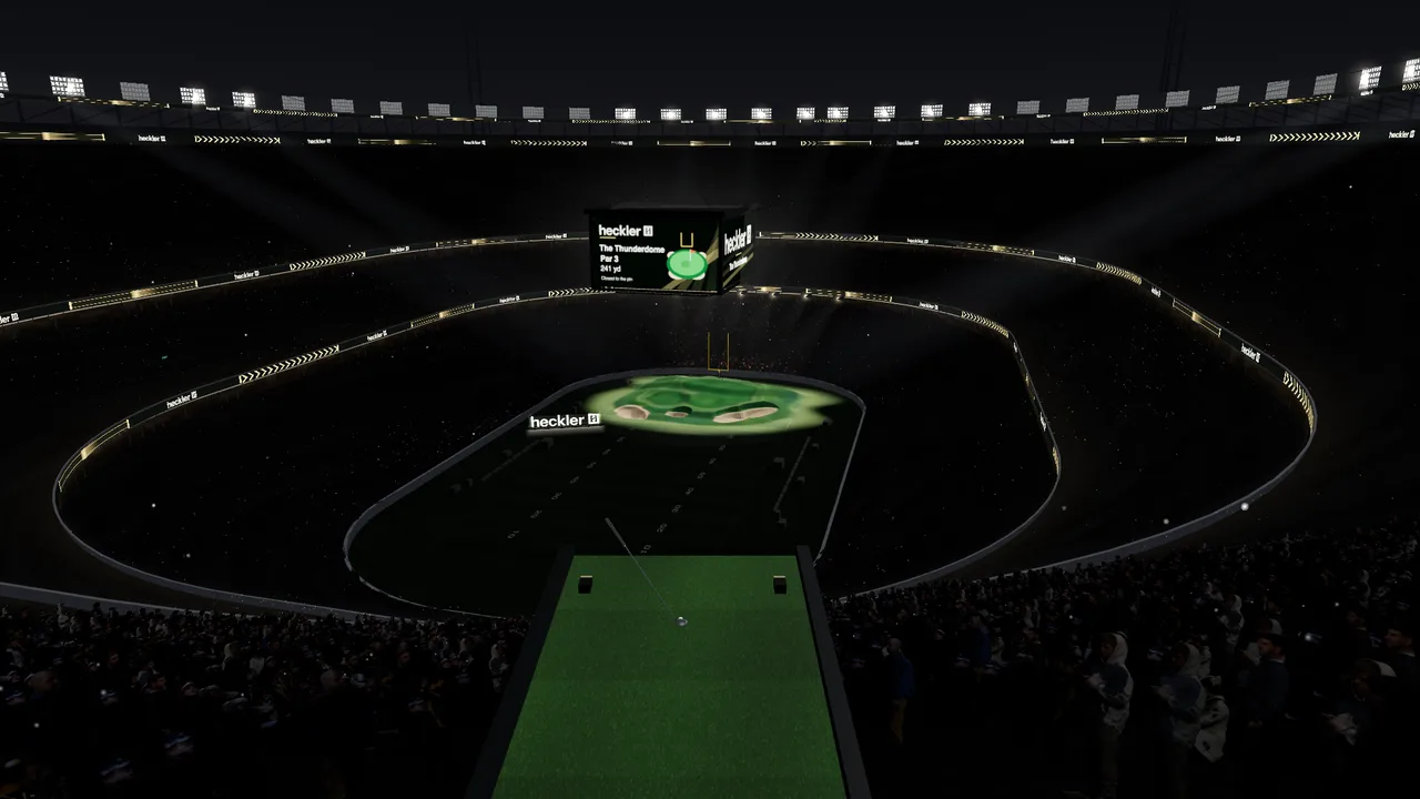 Actual The Thunderdome starting tee in the stands, looking across the dark field to the floodlit green
