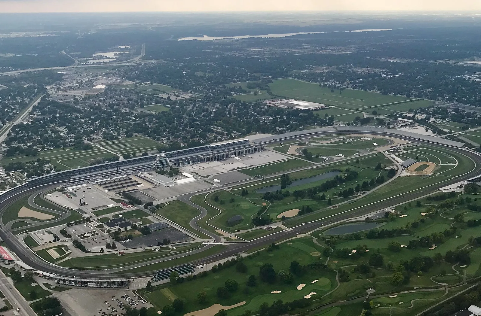 Indianapolis Motor Speedway from above, showing the infield golf-course setting.