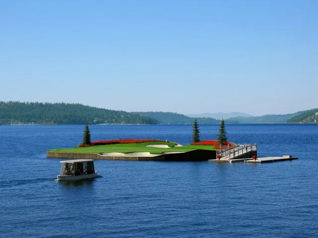 The floating 14th green at Coeur d’Alene, photographed from shore.