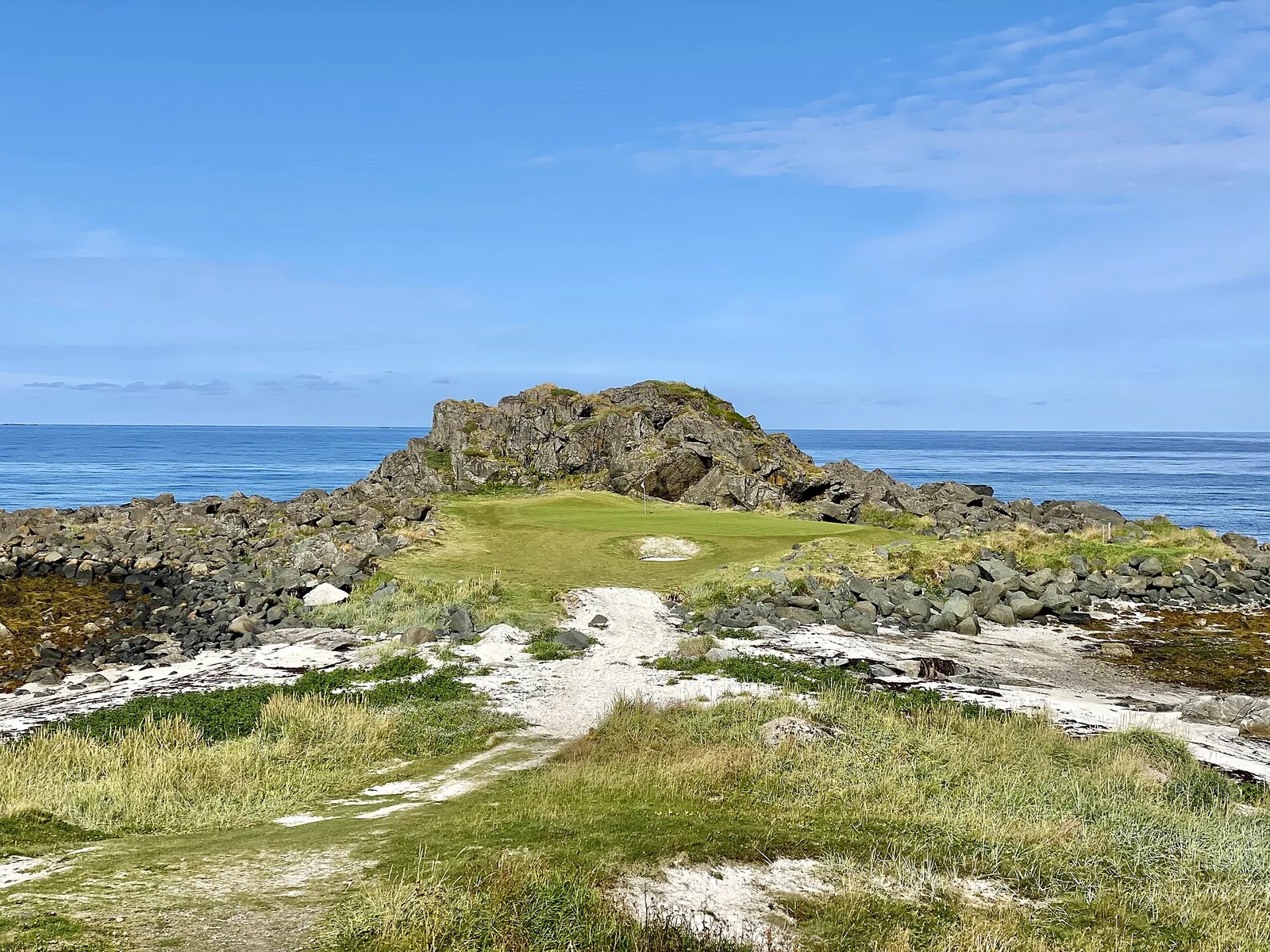 The second hole at Lofoten Links. This daytime photograph shows the coastal setting, not the midnight sun.